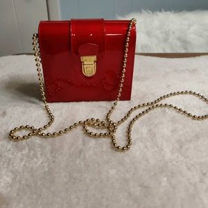 Stuart Weitzman Italian patent leather ruby red mini crossbody with gold beaded